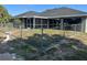 Fenced backyard with screened lanai at 21215 Cottonwood Ave, Port Charlotte, FL 33952