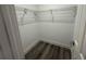 Walk-in closet featuring modern floors, wire shelving and neutral paint at 21215 Cottonwood Ave, Port Charlotte, FL 33952