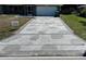 Long decorative driveway with beautiful stone work and pavers leading to the front of the house at 21215 Cottonwood Ave, Port Charlotte, FL 33952