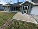 Charming home featuring a walkway with decorative stone and well-maintained landscaping at 21215 Cottonwood Ave, Port Charlotte, FL 33952
