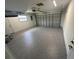 Spacious garage with freshly sealed epoxy flooring at 21215 Cottonwood Ave, Port Charlotte, FL 33952