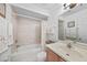 This bathroom features a shower and tub combo, updated vanity, and neutral wall color at 25225 Rampart Blvd # 1607, Punta Gorda, FL 33983