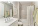 Bathroom with bright walls, vanity, sink, toilet, shower and tile floor at 2636 Mauritania Rd, Punta Gorda, FL 33983