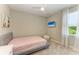 Cozy bedroom features a plush bed, soft carpet, and accent lighting for a comfortable ambiance at 2636 Mauritania Rd, Punta Gorda, FL 33983