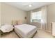 This bedroom has a cozy area with plush seating and ample natural light, creating a relaxing space at 2636 Mauritania Rd, Punta Gorda, FL 33983