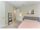 This bedroom has neutral colors, offers natural light and features a mirror and a dresser for storage at 2636 Mauritania Rd, Punta Gorda, FL 33983
