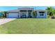 Beautiful home with manicured lawn, two-car garage, and lovely landscaping at 2636 Mauritania Rd, Punta Gorda, FL 33983