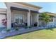 Inviting front porch with seating area and manicured landscaping at 2636 Mauritania Rd, Punta Gorda, FL 33983