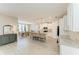 Open-concept kitchen with granite counters, an island, stainless appliances, and adjoining dining area at 2636 Mauritania Rd, Punta Gorda, FL 33983