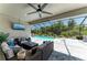 Scenic covered patio features comfortable seating and serene pool views at 2636 Mauritania Rd, Punta Gorda, FL 33983