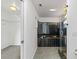 Modern bathroom featuring black tile, bathtub and walk in shower at 2776 Tusket Ave, North Port, FL 34286