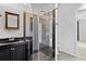 Modern bathroom features a glass enclosed shower, vanity with storage, and modern fixtures at 2776 Tusket Ave, North Port, FL 34286