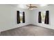 Bright bedroom with neutral carpet, white walls, and two windows that provide natural light at 2776 Tusket Ave, North Port, FL 34286