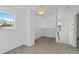 Bonus room with neutral carpet, walls and a large window for natural light at 2776 Tusket Ave, North Port, FL 34286