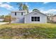 Charming two-story home with a well-manicured lawn and spacious driveway at 2776 Tusket Ave, North Port, FL 34286