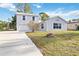 Charming two-story home with a well-manicured lawn and spacious driveway at 2776 Tusket Ave, North Port, FL 34286