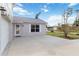 Home exterior showing a two-story design, a driveway, and a front door, with lush landscaping at 2776 Tusket Ave, North Port, FL 34286