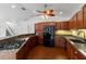 Updated kitchen with stainless steel appliances and plentiful wood cabinets at 2776 Tusket Ave, North Port, FL 34286