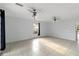 Open living area featuring neutral paint, tile floors, and a ceiling fan with light at 2776 Tusket Ave, North Port, FL 34286