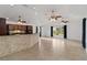 Bright living room with ceramic tile floors and three ceiling fans at 2776 Tusket Ave, North Port, FL 34286