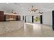 Open floor plan with living space with tile flooring and a kitchen with cherry cabinets at 2776 Tusket Ave, North Port, FL 34286