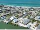 Picturesque aerial view of coastal homes, showcasing proximity to the beach and stunning ocean views at 2779 N Beach Rd # A, Englewood, FL 34223