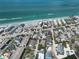 Expansive aerial view of a coastal neighborhood, featuring beachfront homes and sparkling ocean waters at 2779 N Beach Rd # A, Englewood, FL 34223
