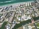 Beautiful aerial view showcasing beachfront homes and calm waters, perfect for serene coastal living at 2779 N Beach Rd # A, Englewood, FL 34223