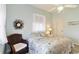Relaxing bedroom with ceiling fan, wood floors, and decorative wreath at 2779 N Beach Rd # A, Englewood, FL 34223