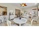 Open floor plan dining room features light-colored furniture, and is adjacent to other living areas at 2779 N Beach Rd # A, Englewood, FL 34223