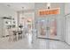 Bright dining room with tile floors, chandelier, and views of the front entrance at 2779 N Beach Rd # A, Englewood, FL 34223