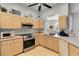 Practical kitchen featuring bright cabinets, stainless steel appliances, and a functional layout at 2779 N Beach Rd # A, Englewood, FL 34223