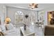 Bright living room with large windows, light wood floors, and neutral decor is perfect for relaxing and entertaining at 2779 N Beach Rd # A, Englewood, FL 34223