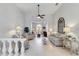 Spacious living room with ceiling fan and view into other rooms at 2779 N Beach Rd # A, Englewood, FL 34223