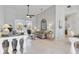 Open-concept living room with high ceilings, neutral tones, and tile flooring at 2779 N Beach Rd # A, Englewood, FL 34223
