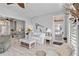 Bright living room featuring neutral decor and furnishings adjacent to outdoor patio at 2779 N Beach Rd # A, Englewood, FL 34223