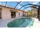 Inviting screened-in pool area with ample seating and tranquil water at 2779 N Beach Rd # A, Englewood, FL 34223