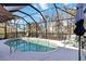 Screened-in pool area with mature landscaping offers a private outdoor oasis at 2779 N Beach Rd # A, Englewood, FL 34223