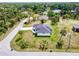 A beautiful single-Gathering home with a gray roof surrounded by palm trees and lush greenery at 3140 Lopinto St # 1, North Port, FL 34287