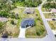 Aerial view of a home with a long driveway in a quiet neighborhood at 3140 Lopinto St # 1, North Port, FL 34287