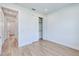 Neutral bedroom with bi-fold closet doors and wood-look flooring, creating a serene and inviting space at 3140 Lopinto St # 1, North Port, FL 34287