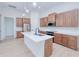 Modern kitchen featuring an island, stainless steel appliances, and wood cabinets at 3140 Lopinto St # 1, North Port, FL 34287