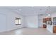 Open-concept living room with light wood floors, recessed lighting, and a modern kitchen area at 3140 Lopinto St # 1, North Port, FL 34287