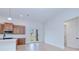 Open floor plan living room with light flooring and view of the outdoors through glass doors at 3140 Lopinto St # 1, North Port, FL 34287