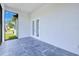 Patio with dark tile, white walls, and outdoor access at 3140 Lopinto St # 1, North Port, FL 34287