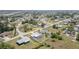Aerial shot showcasing a home with a screened-in pool, nestled within a fenced backyard at 3187 Elkcam Blvd, Port Charlotte, FL 33952