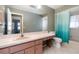 Bathroom with a large vanity, ample counter space, and a shower-tub combination, providing functionality at 3187 Elkcam Blvd, Port Charlotte, FL 33952