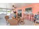 Enclosed lanai with dining set and bar stools at 3187 Elkcam Blvd, Port Charlotte, FL 33952