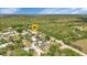 Aerial view of the neighborhood showcasing proximity to the river and surrounded by green landscapes at 3215 Cedarbrook Dr, Punta Gorda, FL 33982