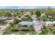 A high-angle view displaying the home's meticulously kept exterior, lush landscaping, and private screened patio at 3215 Cedarbrook Dr, Punta Gorda, FL 33982